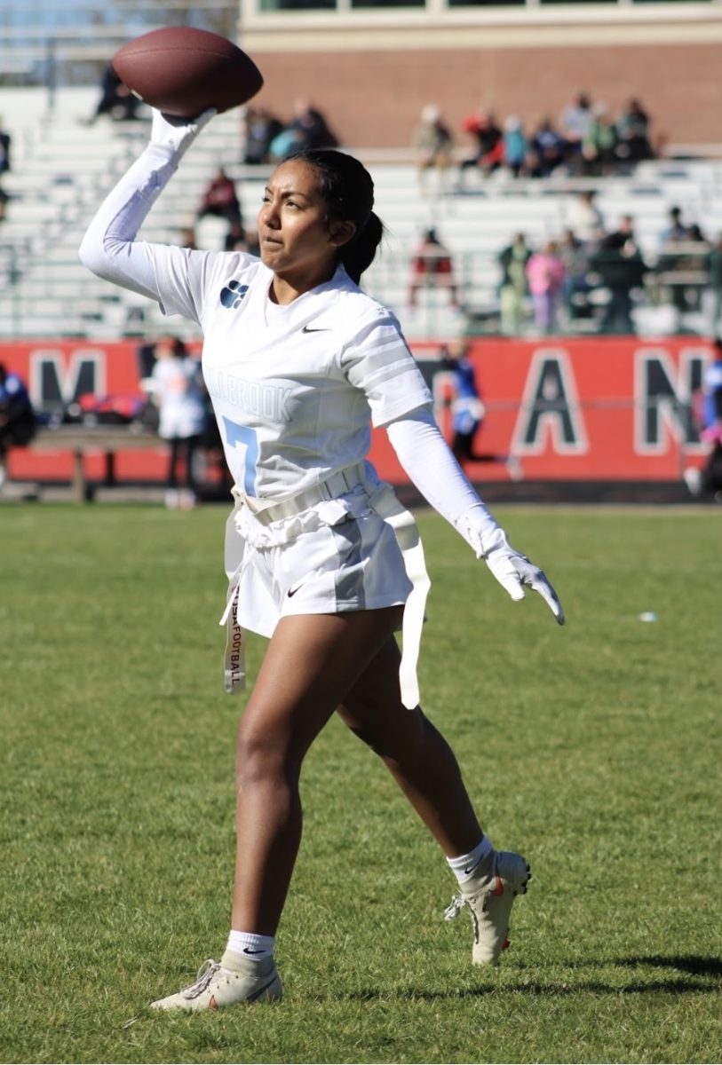 Dulce Marban pictured playing flag football. She plays as a center and has been a member of the Millbrook Women's Flag Football team since its inaugural season!